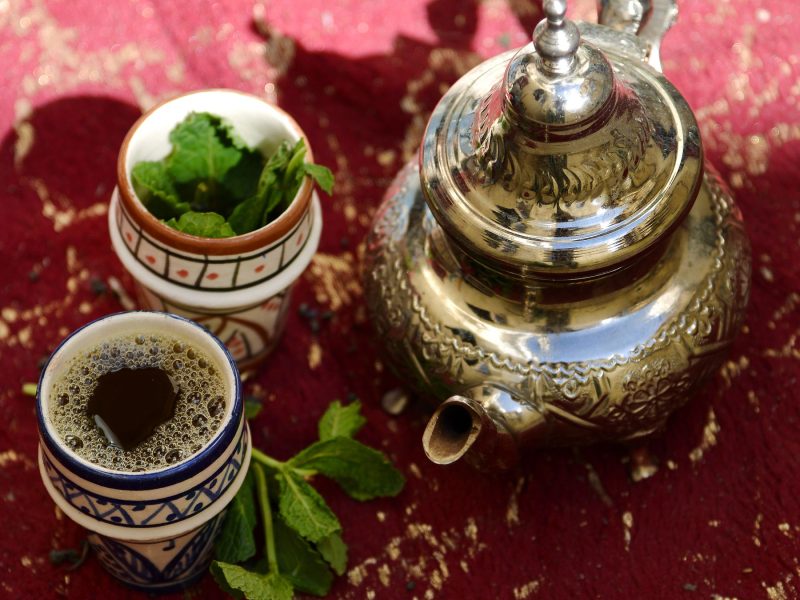 Silver teapot and glasses of Moroccan mint tea